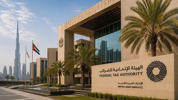 Federal Tax Authority building in Dubai with its bilingual sign and the UAE flag